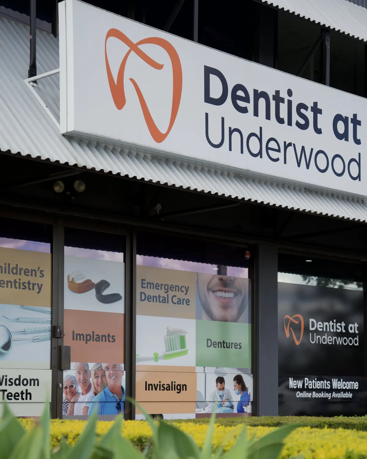 The Dentist at Underwood sign above the clinic on Logan Road